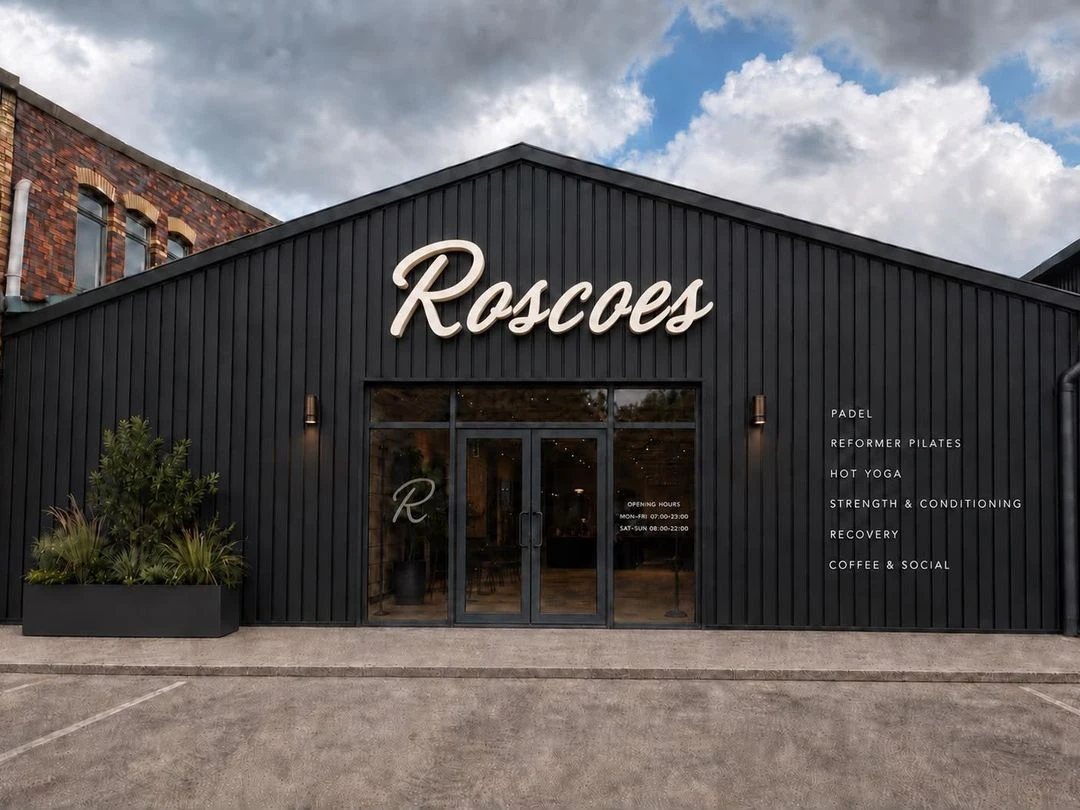 The front of Roscoes: black timber clubhouse with the Roscoes sign above glass doors